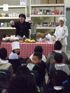 Tony Bratton, a chef in the Toms River school system, lectures students on the benefits of eating healthy while preparing a smoothie at the Foodbank of Monmouth and Ocean Counties in Neptune Oct. 16.