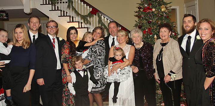 At Deal Country Club  Sat., Jan. 4 were newlyweds Joe Maggio, owner of Frank’s Deli in Asbury Park, and Mary Hogan Maggio. With the Maggios were  (left to right)  Casey Hogan holding son LanDan, David and Matt Hogan, Aileen Hogan, Melinda Maggio holding Isabelle Hogan and Noah Hogan in front of them, the groom, Joe, the bride, Mary, holding Eliana, Eileen Walker, Maria Maggio, T.J. Maggio and his fiance Donna Bartlett. - Coaster photo by Mike Kearns