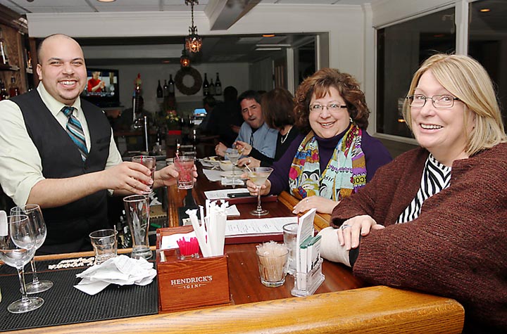 Enjoying a drink at the bar at Giamano’s were Carol Berlen of Interlaken and Kathy McGill of Bradley Beach. Serving them was Daniel Oesterlen.