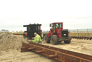 Coaster Photo - A contruction crew is scheduled to being driving pilings into the sand today (May 29) for a new boardwalk in Ocean Grove to replace the section destroyed by Hurricane Sandy.