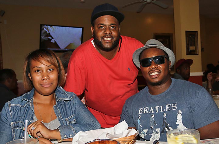 Hassan Scott (center) of At the Table in Asbury Park is pictured with customers Hatasha and Daryl Dixson, Neptune.