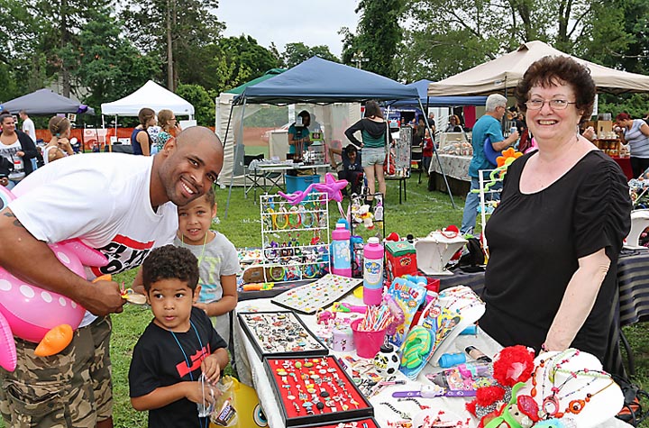 At Neptune City Day in Memorial Park Kim Waters of Kim’s Kids Stuff was at her booth. Shopping there were Deshon Hardy of Neptune with Aniya amd Judaih.