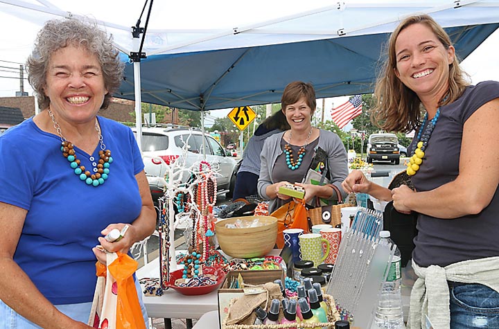 Shopping at the sidewalk sale at Bungalow Road in Avon were Mari McDevitt and Kelly McDevitt Connors, both of Avon. Waiting on them was Katie Cashman of Bungalow Road.