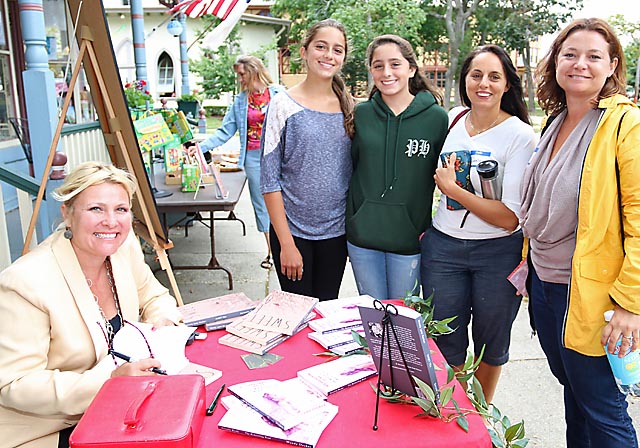 Signing copies of her book at The Hub in Ocean Grove was author Wendy Lynn Decker pictured with Emma, Audrey and Danene Wilenta and Danielle Coyle, all of Wall Township. 