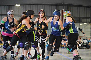 Avon resident Jessica O’Hanlon (fourth from right) is a member of the Red Bank Roller Vixens. Photo by John Keoni for the Red Bank Roller Vixens.