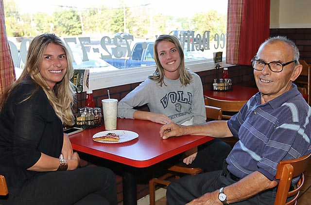 Evangelia Scheidt of John’s Cracker Barrel in the Shark River Hills section of Neptune chats with Kassidy Voll and Chris Cosmas at the business.