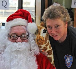 Police Sgt. Connie Breech with a well-known figure. From facebook.com/Asburyparktoycentral