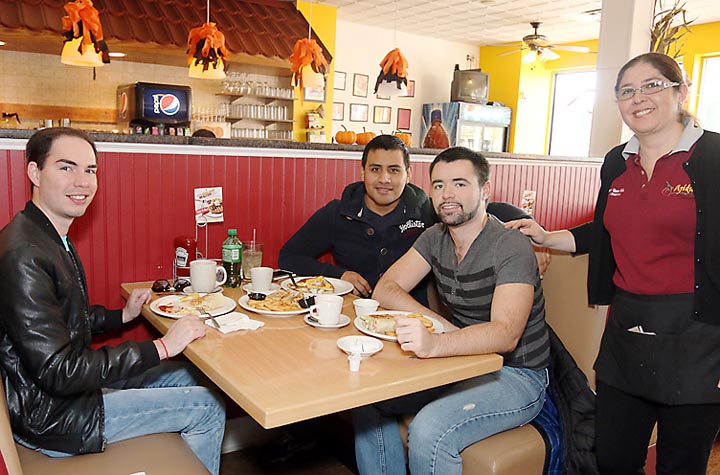 Enjoying lunch at Sweetpepper in Bradley Beach were Carlos Coello-Beseke, Alex Cannon and Richard Arndt, all of Bradley Beach. Waiting on them was Daiana Padilla, business owner.