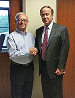 Coaster Photo - Rick Cuttrell (right), Neptune Township clerk, is congratuled by Joel Popkin, former Neptune City borough clerk, who nominated Cuttrell for an award.