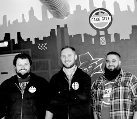 Coaster Photo - At the Dark City Brewing Company are Stephen Bohacik, founder Kevin Sharpe and Jaret Gelb.