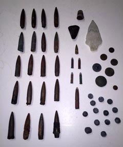 Artifacts recently found during the sand-replenishment project from Deal to Loch Arbour. They include machine gun bullets , 22 cal rifles bullets, and one unknown caliber maybe a tracer round, then an ancient great white shark tooth, a quartz Indian spearhead, a copper thimble, and two Indian head pennies 1897 and 1901, and an Italian lire coin circa late 1860s; and 13 musket balls.