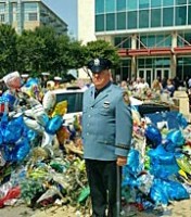 Asbury Park Police Officer Eugene Dello, a delegate to the New Jersey PBA, stands in uniform at a memorial to the slain Dallas police officers.