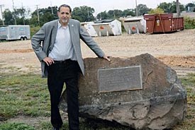 Photo by Anthony - Don Lewis, curator of the Bradley Beach Museum, is pictured next to the boulder with acommemorative bronze plaque which marked the site where the Freedom Train was stationed in the borough in 1976.