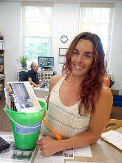 Rita Post, Bradley Beach library program coordinator, is pictured with the Welcome Pail available for newcomers of the borough. It can be picked up at the library circulation desk.