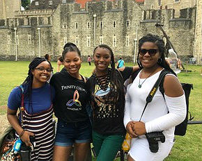 Trinity Church choir members Keara Cenatus, Nadia McMillian, Daziah Taylor and Kyla Whitlock in front of The Tower Of London during their residency at a cathedral.